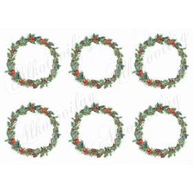 Karácsonyi koszorúk tobozokkal, piros bogyókkal